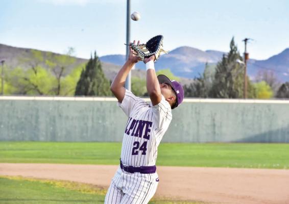 David Valenzuela reaches to catch a ball during a recent game at Kokernot Field. Photo by Felipe Fierro