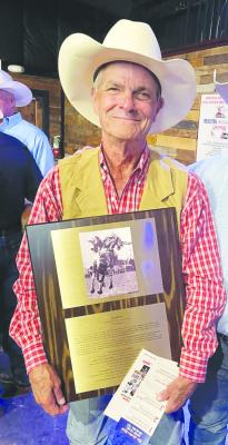 Jim Jones poses here with the induction plaque he received at this year’s Texas Rodeo Cowboy Hall of Fame induction ceremony. Courtesy photo