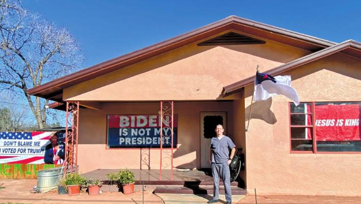 Patriot Sean Watson stands in front of his home on Sul Ross Avenue in Alpine. Avalanche photo by Gail Diane Yovanovich