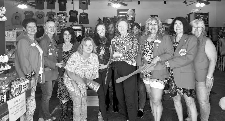 The newest store in Alpine, Javelinas on Holland celebrated its grand opening with a ribbon cutting last Tuesday. Javelinas owners and operators pictured in front are Daynna Torres, Emily Harrod with Mimi, and Jennifer Harrod, surrounded by the Alpine Ambassadors. Photo by Kara Gerbert