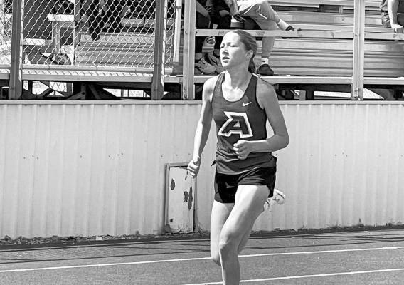 Colette Fowlkes is pictured running in one of the longer races that she excels in during the recent Fightn’ Buck Relays. Courtesy photo