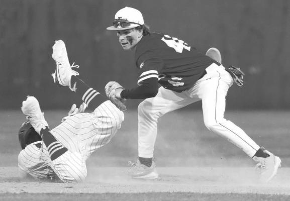 A Midland player attempts to tag out an Alpine runner as he slides into second base last Tuesday at Kokernot Field. Photo courtesy of Noe Lujan