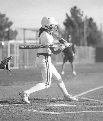 Taryn Hardin steps up to bat during the Lady Buck’s recent home game with the Pecos Eagles. Photo by Annika Canaba.