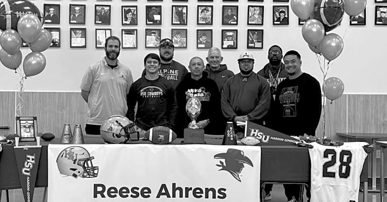Alpine High School senior Reese Ahrens, accompanied by his sister Amanda, dad Keith, mom Niki, and brother Calan is all smiles as he signs his letter of intent on Tuesday morning to play football for Hardin Simmons University. Courtesy photo