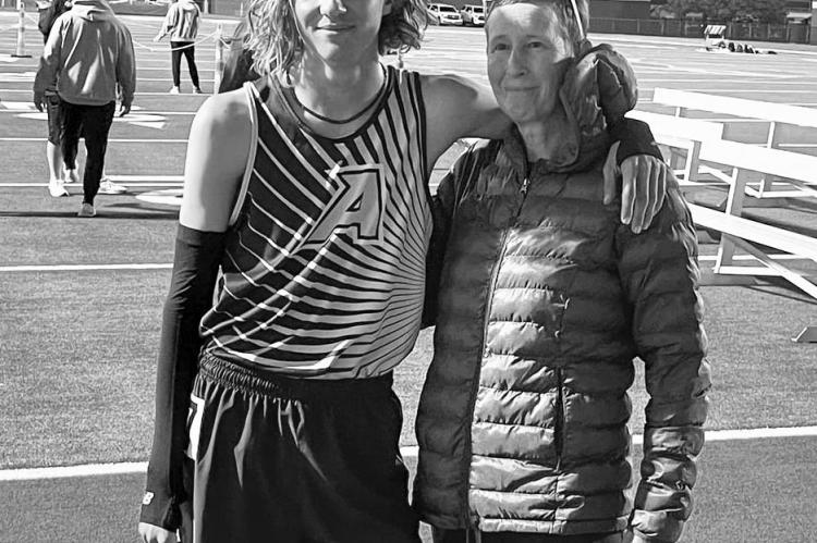 Coach Cory Cason is pictured here with her son Hatfield Cason after a track meet earlier in the year.
