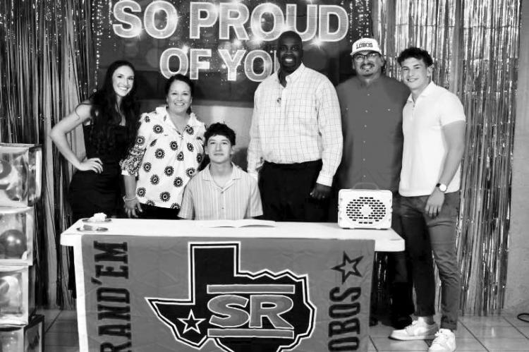 Jace Canaba along with his family and Coach Aaron Hardwick pose for a photo during the senior prom where Canaba signed with Sul Ross State University to play basketball for the Lobos. Courtesy photo