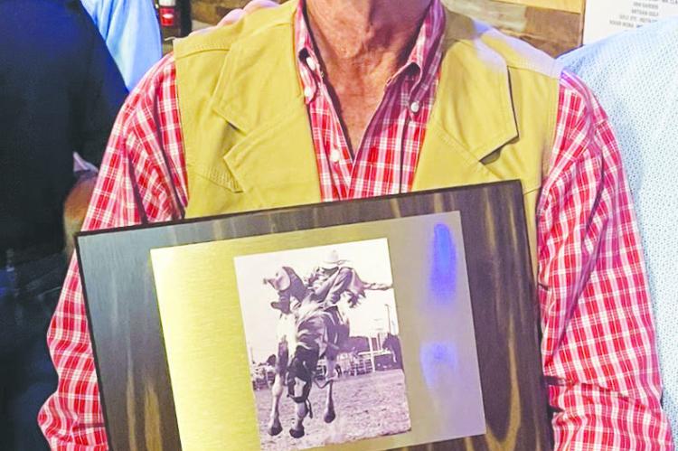 Jim Jones poses here with the induction plaque he received at this year’s Texas Rodeo Cowboy Hall of Fame induction ceremony. Courtesy photo